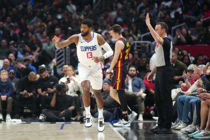 Mar 17, 2024; Los Angeles, California, USA; LA Clippers forward Paul George (13) gestures after a three-point basket against the Atlanta Hawks in the second half at Crypto.com Arena. Mandatory Credit: Kirby Lee-USA TODAY Sports