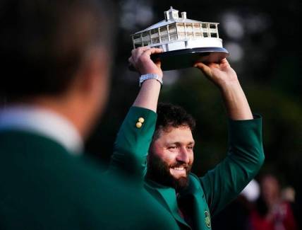 Apr 9, 2023; Augusta, Georgia, USA; Masters champion Jon Rahm holds up the trophy after the final round of The Masters golf tournament.