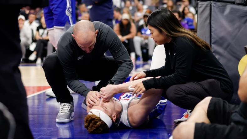 Mar 18, 2024; Sacramento, California, USA; Sacramento Kings guard Kevin Huerter (9) suffers an injury during the first quarter against the Memphis Grizzlies at Golden 1 Center. Mandatory Credit: Sergio Estrada-USA TODAY Sports