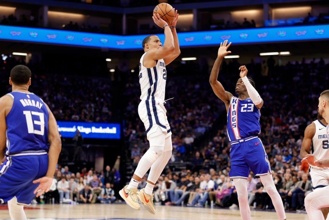 Mar 18, 2024; Sacramento, California, USA; Memphis Grizzlies guard Desmond Bane (22) shoots the ball against Sacramento Kings guard Keon Ellis (23) during the fourth quarter  at Golden 1 Center. Mandatory Credit: Sergio Estrada-USA TODAY Sports