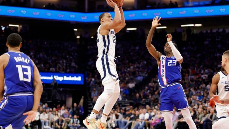 Mar 18, 2024; Sacramento, California, USA; Memphis Grizzlies guard Desmond Bane (22) shoots the ball against Sacramento Kings guard Keon Ellis (23) during the fourth quarter  at Golden 1 Center. Mandatory Credit: Sergio Estrada-USA TODAY Sports