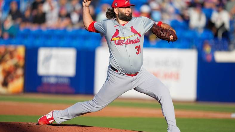 Mar 19, 2024; Port St. Lucie, Florida, USA; St. Louis Cardinals starting pitcher Lance Lynn (31) throws a pitch against the New York Mets during the first inning at Clover Park. Mandatory Credit: Rich Storry-USA TODAY Sports