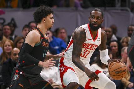 Mar 19, 2024; Washington, District of Columbia, USA; Houston Rockets forward Jeff Green (32) dribbles a sWashington Wizards guard Jules Bernard (14) defends during the first half  at Capital One Arena. Mandatory Credit: Tommy Gilligan-USA TODAY Sports