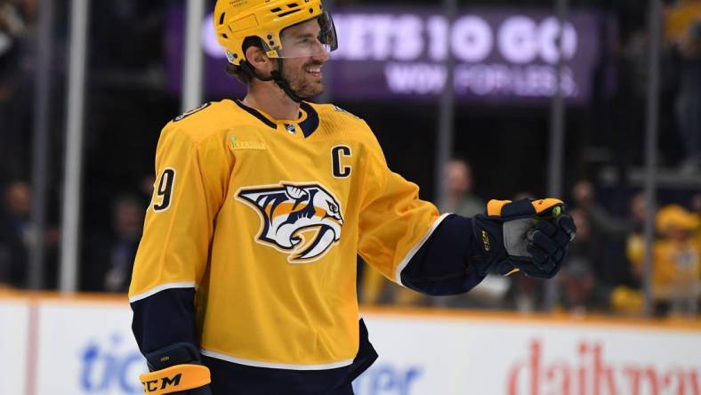 Mar 19, 2024; Nashville, Tennessee, USA; Nashville Predators defenseman Roman Josi (59) celebrates after scoring during the first period against the San Jose Sharks at Bridgestone Arena. Mandatory Credit: Christopher Hanewinckel-USA TODAY Sports