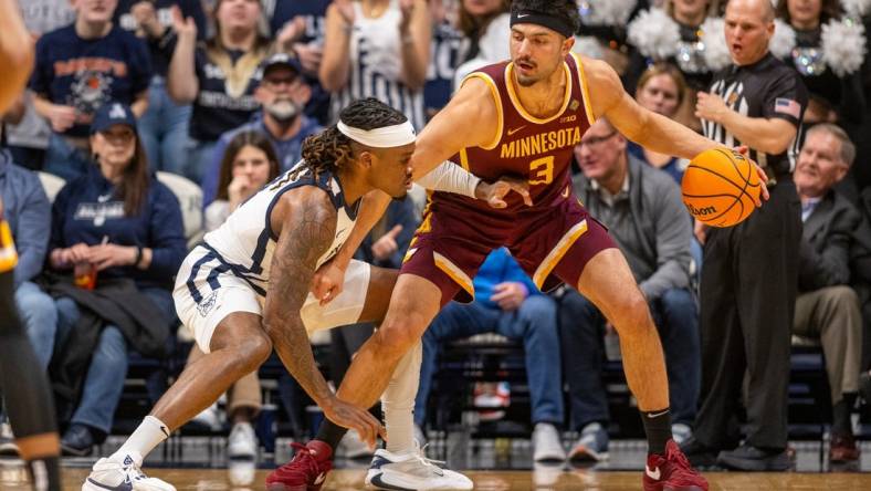 Butler Bulldogs guard Posh Alexander, left, defends Minnesota Golden Gophers forward Dawson Garcia (3) during the first half of an NCAA/NIT game, Tuesday, March 19, 2024, at Hinkle Fieldhouse on the campus of Butler University in Indianapolis.