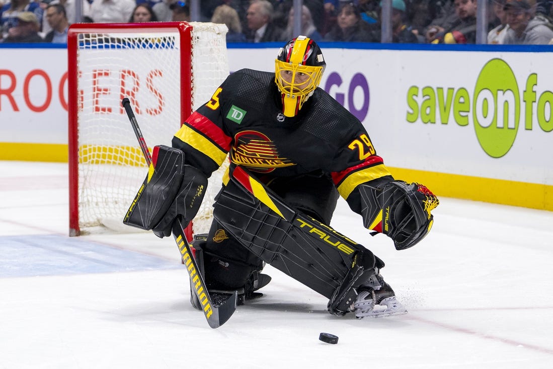 Mar 19, 2024; Vancouver, British Columbia, CAN; Vancouver Canucks goalie Casey DeSmith (29) handles the puck against the Buffalo Sabres in the second period at Rogers Arena. Mandatory Credit: Bob Frid-USA TODAY Sports