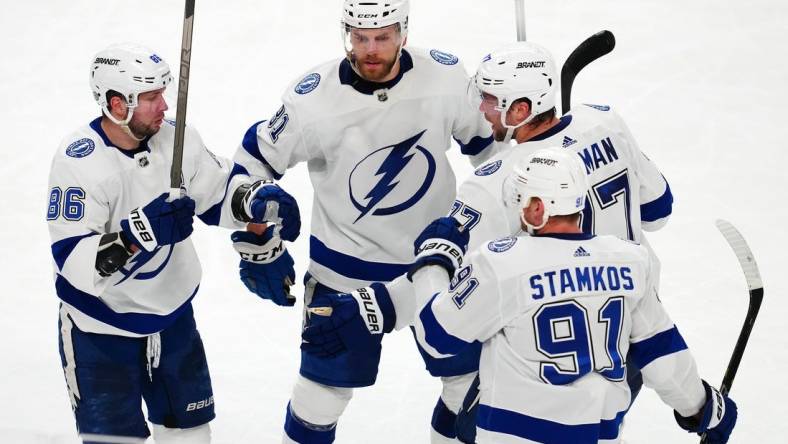 Mar 19, 2024; Las Vegas, Nevada, USA; Tampa Bay Lightning right wing Nikita Kucherov (86) celebrates with team mates after scoring an empty net goal against the Vegas Golden Knights during the third period at T-Mobile Arena. Mandatory Credit: Stephen R. Sylvanie-USA TODAY Sports