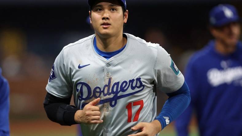 [US, Mexico & Canada customers only] March 20, 2024; Seoul, SOUTH KOREA; Los Angeles Dodgers player Shohei Ohtani reacts after playing against the San Diego Padres during a MLB regular season Seoul Series game at Gocheok Sky Dome. Mandatory Credit: Kim Hong-Ji/Reuters via USA TODAY Sports