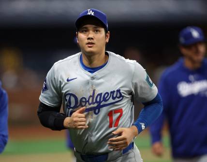 [US, Mexico & Canada customers only] March 20, 2024; Seoul, SOUTH KOREA; Los Angeles Dodgers player Shohei Ohtani reacts after playing against the San Diego Padres during a MLB regular season Seoul Series game at Gocheok Sky Dome. Mandatory Credit: Kim Hong-Ji/Reuters via USA TODAY Sports