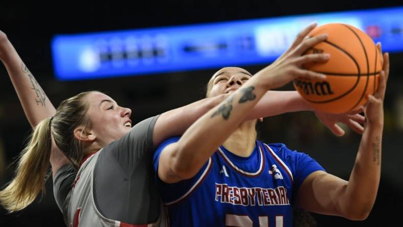 Bryanna Brady of Presbyterian is fouled going for a shot against Sacred Heart in the NCAA Women's Basketball Tournament in Columbia.