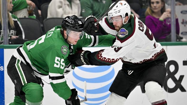 Mar 20, 2024; Dallas, Texas, USA; Arizona Coyotes left wing Michael Carcone (53) tries to skate past Dallas Stars defenseman Thomas Harley (55) during the first period at the American Airlines Center. Mandatory Credit: Jerome Miron-USA TODAY Sports