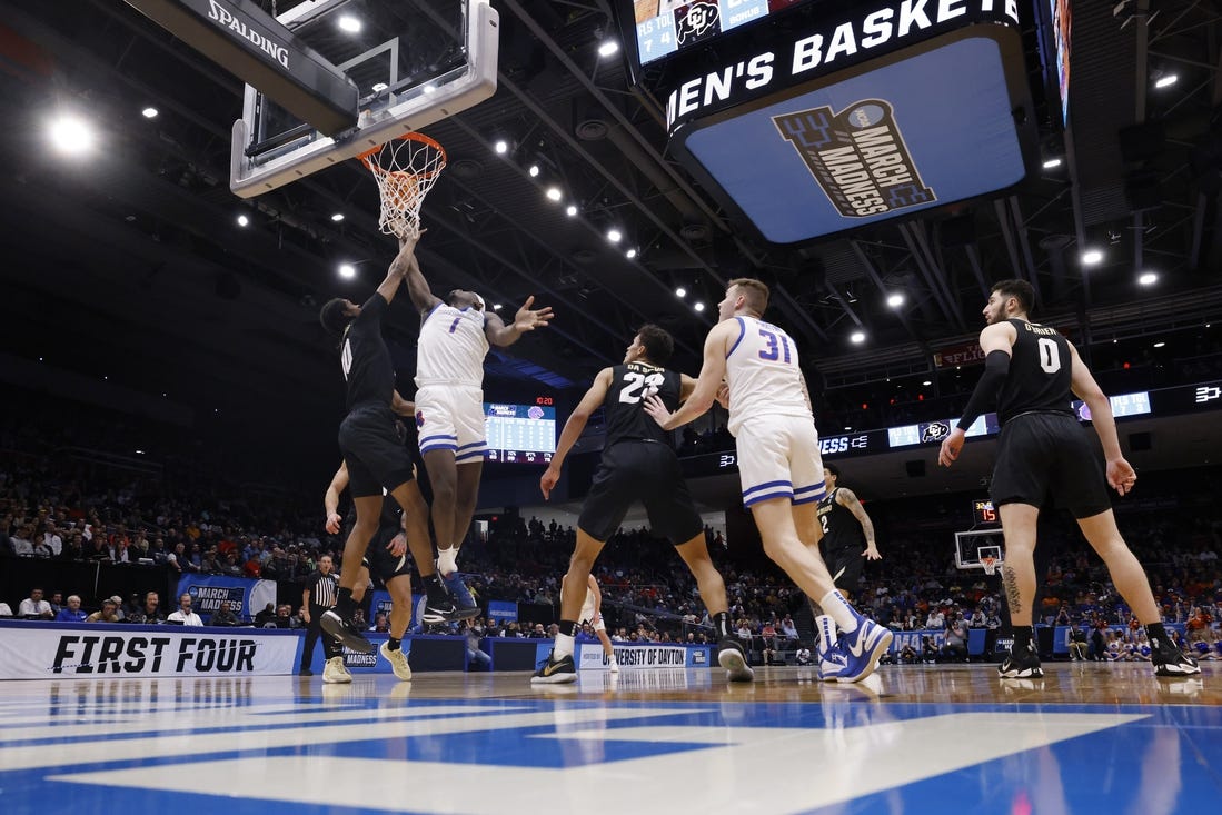 Mar 20, 2024; Dayton, OH, USA; Boise State Broncos forward O'Mar Stanley (1) goes to the basket defended by Colorado Buffaloes forward Cody Williams (10) in the first half at UD Arena. Mandatory Credit: Rick Osentoski-USA TODAY Sports