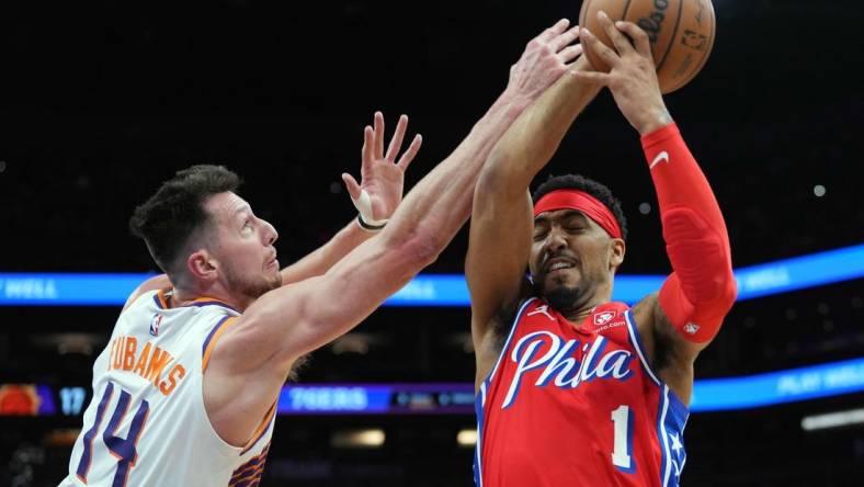 Mar 20, 2024; Phoenix, Arizona, USA; Phoenix Suns forward Drew Eubanks (14) guards Philadelphia 76ers forward KJ Martin (1) during the first half at Footprint Center. Mandatory Credit: Joe Camporeale-USA TODAY Sports