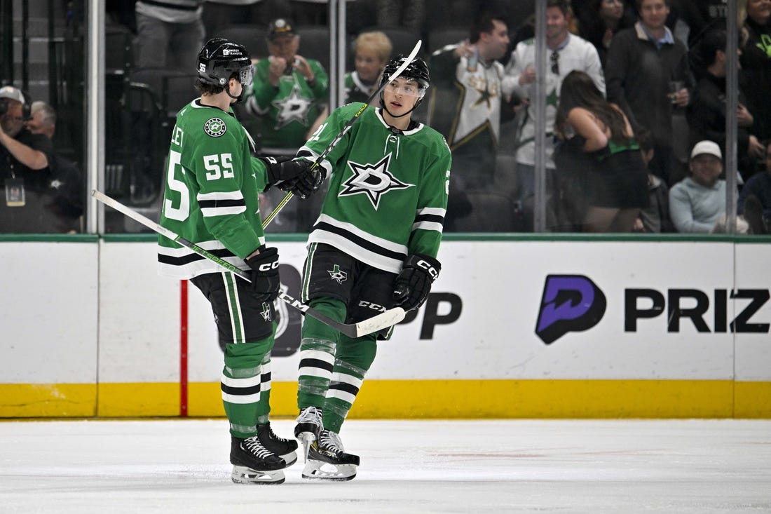 Mar 20, 2024; Dallas, Texas, USA; Dallas Stars defenseman Thomas Harley (55) and left wing Jason Robertson (21) celebrates a goal scored by Robertson against the Arizona Coyotes during the third period at the American Airlines Center. Mandatory Credit: Jerome Miron-USA TODAY Sports