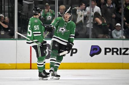 Mar 20, 2024; Dallas, Texas, USA; Dallas Stars defenseman Thomas Harley (55) and left wing Jason Robertson (21) celebrates a goal scored by Robertson against the Arizona Coyotes during the third period at the American Airlines Center. Mandatory Credit: Jerome Miron-USA TODAY Sports