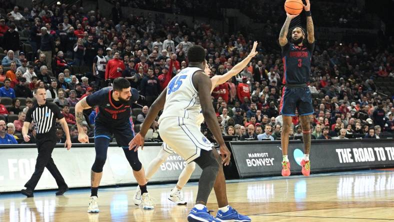 Mar 21, 2024; Omaha, NE, USA;  Duquesne Dukes guard Dae Dae Grant (3) shoots during the first half against the Brigham Young Cougars during the first round of the NCAA Tournament at CHI Health Center Omaha. Mandatory Credit: Steven Branscombe-USA TODAY Sports