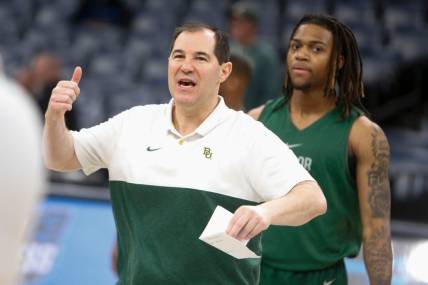 Baylor’s head coach Scott Drew directs his players during open practices for 2024 NCAA Tournament teams at FedExForum in Memphis, Tenn., on Thursday, March 21, 2024.