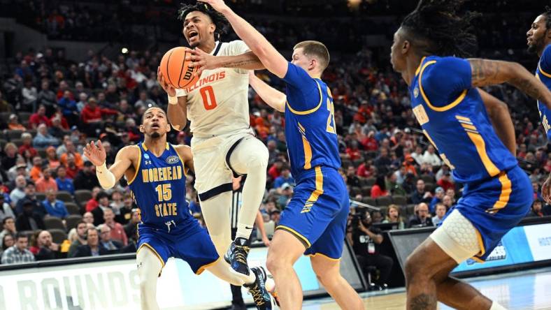 Mar 21, 2024; Omaha, NE, USA; Illinois Fighting Illini guard Terrence Shannon Jr. (0) drives against Morehead State Eagles guard Riley Minix (22) in the first half during the first round of the NCAA Tournament at CHI Health Center Omaha. Mandatory Credit: Steven Branscombe-USA TODAY Sports