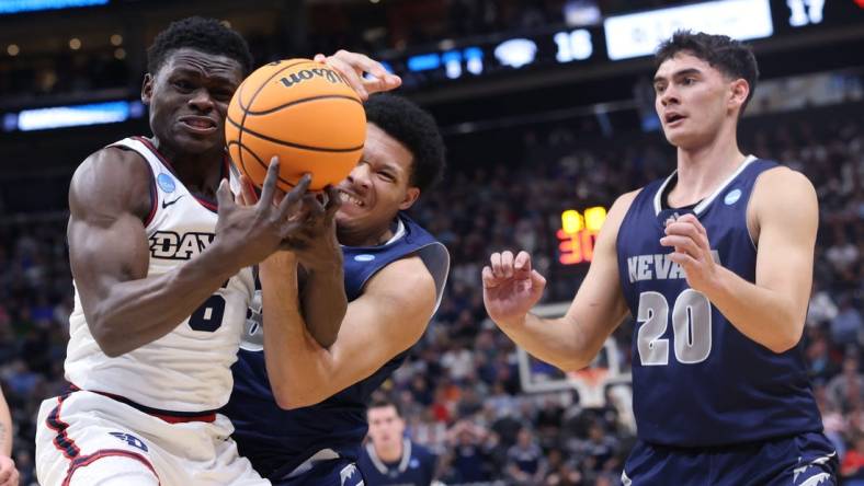 Mar 21, 2024; Salt Lake City, UT, USA; Dayton Flyers guard Enoch Cheeks (6) battles for the ball against  Nevada Wolf Pack forward Tylan Pope (33)during the first half in the first round of the 2024 NCAA Tournament at Vivint Smart Home Arena-Delta Center. Mandatory Credit: Rob Gray-USA TODAY Sports