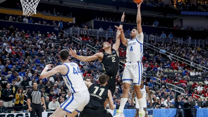 Mar 21, 2024; Pittsburgh, PA, USA; Kentucky Wildcats forward Tre Mitchell (4) jumps to shoot the ball while Oakland Golden Grizzlies forward Chris Conway (2) attempts to block in the first round of the 2024 NCAA Tournament at PPG Paints Arena. Mandatory Credit: Charles LeClaire-USA TODAY Sports