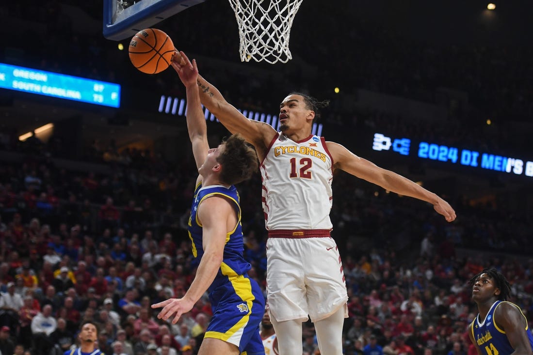 South Dakota State's guard Kalen Garry (10) is blocked by Iowa State's forward Robert Jones (12) during the first half on Thursday, March 21, 2024 at the CHI Health Center in Omaha, Nebraska.