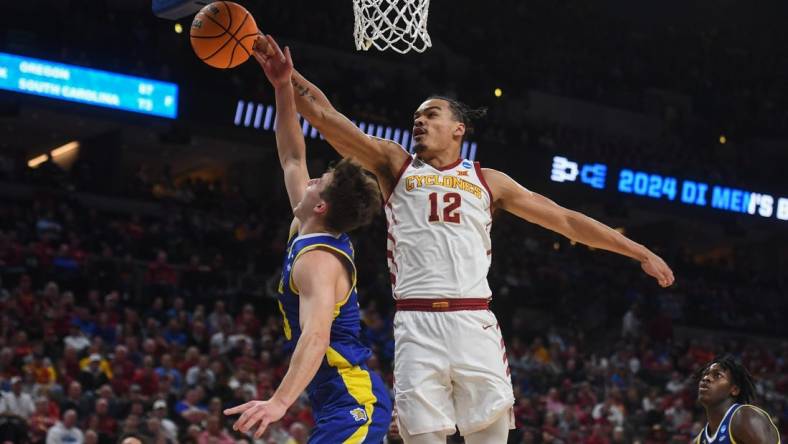 South Dakota State's guard Kalen Garry (10) is blocked by Iowa State's forward Robert Jones (12) during the first half on Thursday, March 21, 2024 at the CHI Health Center in Omaha, Nebraska.