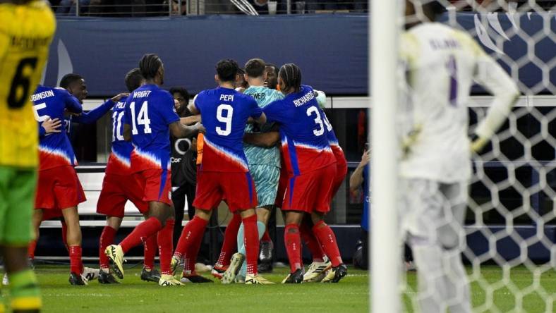 Mar 21, 2024; Arlington, Texas, USA; The United States team celebrates scoring the game tying goal against Jamaica goalkeeper Andre Blake (1) during the second half at AT&T Stadium. Mandatory Credit: Jerome Miron-USA TODAY Sports