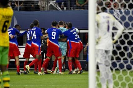 Mar 21, 2024; Arlington, Texas, USA; The United States team celebrates scoring the game tying goal against Jamaica goalkeeper Andre Blake (1) during the second half at AT&T Stadium. Mandatory Credit: Jerome Miron-USA TODAY Sports