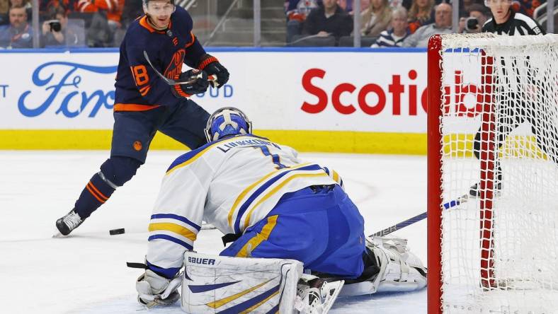 Mar 21, 2024; Edmonton, Alberta, CAN; Buffalo Sabres goaltender Ukko-Pekka Luukkonen (1) makes a save on  on Edmonton Oilers forward Zach Hyman (18) during the first period. at Rogers Place. Mandatory Credit: Perry Nelson-USA TODAY Sports