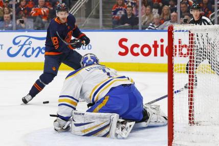 Mar 21, 2024; Edmonton, Alberta, CAN; Buffalo Sabres goaltender Ukko-Pekka Luukkonen (1) makes a save on  on Edmonton Oilers forward Zach Hyman (18) during the first period. at Rogers Place. Mandatory Credit: Perry Nelson-USA TODAY Sports