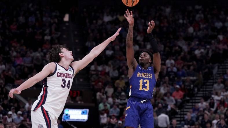 Mar 21, 2024; Salt Lake City, UT, USA; McNeese State Cowboys guard Shahada Wells (13) shoots against Gonzaga Bulldogs forward Braden Huff (34) during the second half in the first round of the 2024 NCAA Tournament at Vivint Smart Home Arena-Delta Center. Mandatory Credit: Gabriel Mayberry-USA TODAY Sports