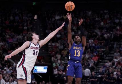 Mar 21, 2024; Salt Lake City, UT, USA; McNeese State Cowboys guard Shahada Wells (13) shoots against Gonzaga Bulldogs forward Braden Huff (34) during the second half in the first round of the 2024 NCAA Tournament at Vivint Smart Home Arena-Delta Center. Mandatory Credit: Gabriel Mayberry-USA TODAY Sports