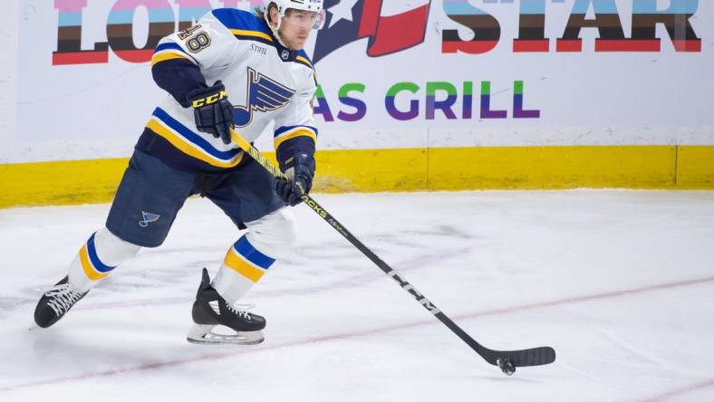 Mar 21, 2024; Ottawa, Ontario, CAN; St. Louis Blues defenseman Scott Perunovich (48) skates with the puck in the third period against the Ottawa Senators at the Canadian Tire Centre. Mandatory Credit: Marc DesRosiers-USA TODAY Sports