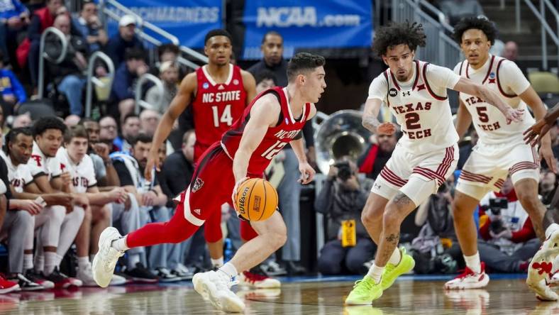 Mar 21, 2024; Pittsburgh, PA, USA; North Carolina State Wolfpack guard Michael O'Connell handles the ball during the first half in the first round of the 2024 NCAA Tournament at PPG Paints Arena. Mandatory Credit: Gregory Fisher-USA TODAY Sports