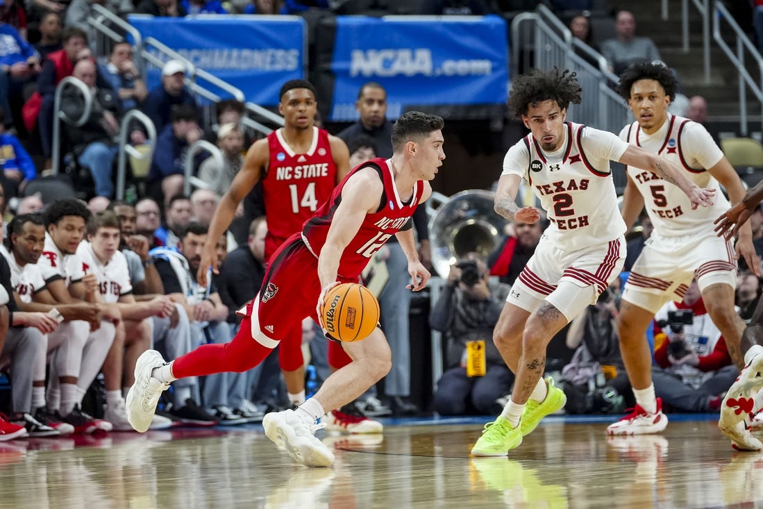 Mar 21, 2024; Pittsburgh, PA, USA; North Carolina State Wolfpack guard Michael O'Connell handles the ball during the first half in the first round of the 2024 NCAA Tournament at PPG Paints Arena. Mandatory Credit: Gregory Fisher-USA TODAY Sports