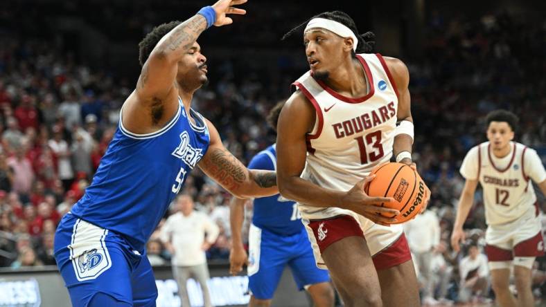 Mar 21, 2024; Omaha, NE, USA; Washington State Cougars guard Isaiah Watts (12) controls the ball against Drake Bulldogs forward Darnell Brodie (51) in the first half in the first round of the 2024 NCAA Tournament at CHI Health Center Omaha. Mandatory Credit: Steven Branscombe-USA TODAY Sports