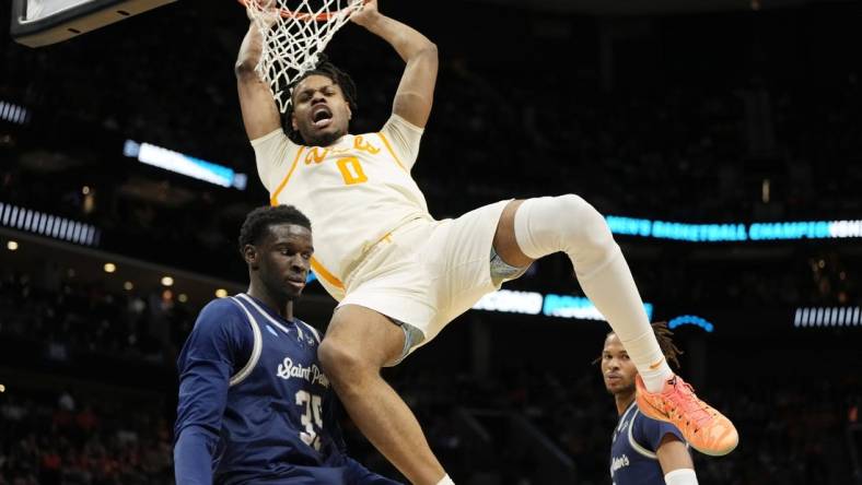 Mar 21, 2024; Charlotte, NC, USA; Tennessee Volunteers forward Jonas Aidoo (0) dunks over Saint Peter's Peacocks forward Mouhamed Sow (35) in the first half of the first round of the 2024 NCAA Tournament at Spectrum Center. Mandatory Credit: Bob Donnan-USA TODAY Sports