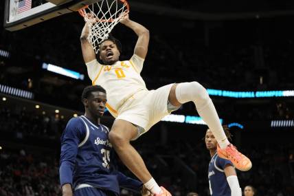 Mar 21, 2024; Charlotte, NC, USA; Tennessee Volunteers forward Jonas Aidoo (0) dunks over Saint Peter's Peacocks forward Mouhamed Sow (35) in the first half of the first round of the 2024 NCAA Tournament at Spectrum Center. Mandatory Credit: Bob Donnan-USA TODAY Sports