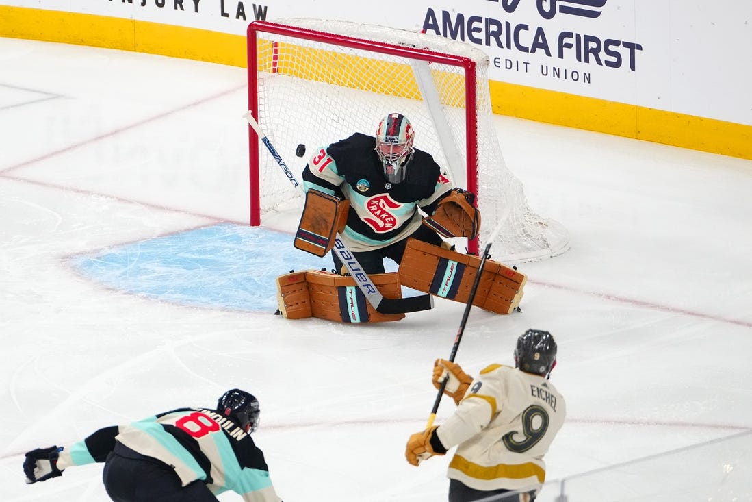 Mar 21, 2024; Las Vegas, Nevada, USA; Seattle Kraken goaltender Philipp Grubauer (31) defends his net against a shot from Vegas Golden Knights center Jack Eichel (9) during the first period at T-Mobile Arena. Mandatory Credit: Stephen R. Sylvanie-USA TODAY Sports