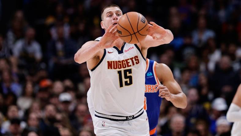 Mar 21, 2024; Denver, Colorado, USA; Denver Nuggets center Nikola Jokic (15) passes the ball in the first quarter against the New York Knicks at Ball Arena. Mandatory Credit: Isaiah J. Downing-USA TODAY Sports