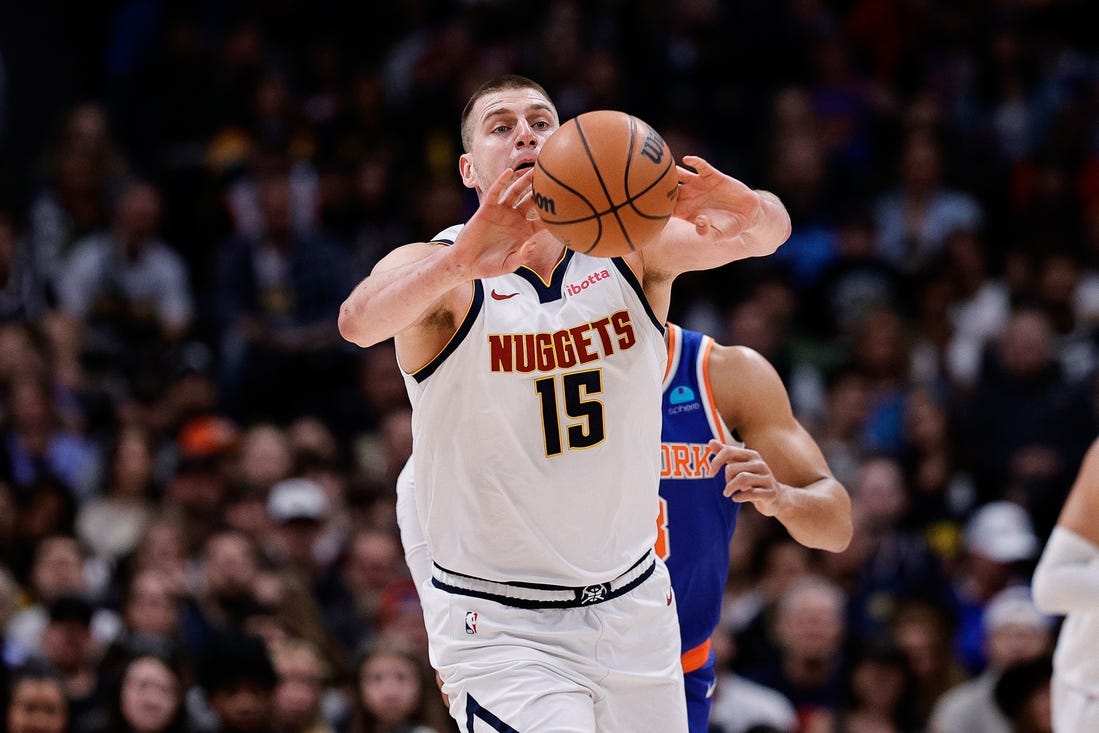 Mar 21, 2024; Denver, Colorado, USA; Denver Nuggets center Nikola Jokic (15) passes the ball in the first quarter against the New York Knicks at Ball Arena. Mandatory Credit: Isaiah J. Downing-USA TODAY Sports