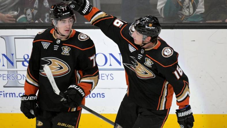 Mar 21, 2024; Anaheim, California, USA;  Anaheim Ducks right wing Frank Vatrano (77) is congratulated by center Ryan Strome (16) after scoring a goal in the third period against the Chicago Blackhawks at Honda Center. Mandatory Credit: Jayne Kamin-Oncea-USA TODAY Sports