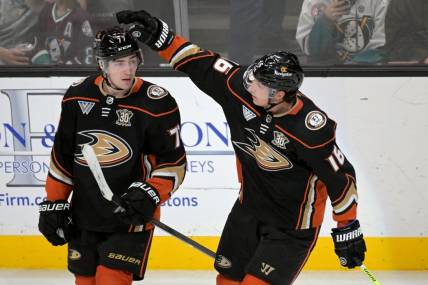 Mar 21, 2024; Anaheim, California, USA;  Anaheim Ducks right wing Frank Vatrano (77) is congratulated by center Ryan Strome (16) after scoring a goal in the third period against the Chicago Blackhawks at Honda Center. Mandatory Credit: Jayne Kamin-Oncea-USA TODAY Sports
