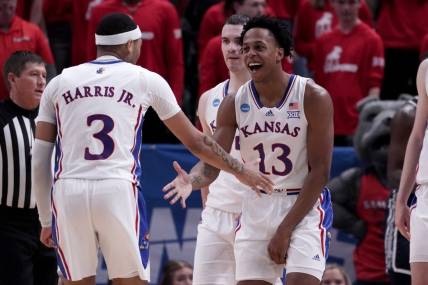 Mar 21, 2024; Salt Lake City, UT, USA; Kansas Jayhawks guard Elmarko Jackson (13) celebrates with guard Dajuan Harris Jr. (3) during the second half in the first round of the 2024 NCAA Tournament against the Samford Bulldogs at Vivint Smart Home Arena-Delta Center. Mandatory Credit: Gabriel Mayberry-USA TODAY Sports