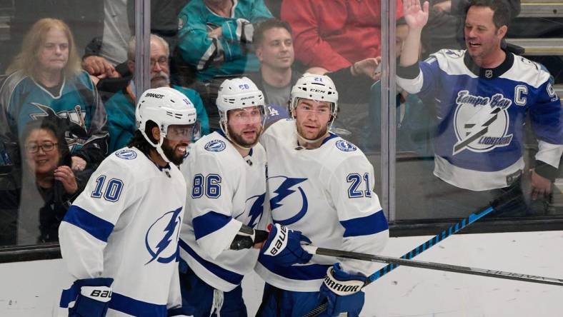 Mar 21, 2024; San Jose, California, USA; Tampa Bay Lightning center Brayden Point (21) celebrates with right wing Nikita Kucherov (86) and left wing Anthony Duclair (10) after scoring his second goal of the game against the San Jose Sharks during the third period at SAP Center at San Jose. Mandatory Credit: Robert Edwards-USA TODAY Sports