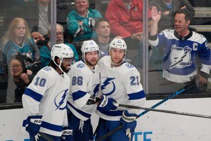 Mar 21, 2024; San Jose, California, USA; Tampa Bay Lightning center Brayden Point (21) celebrates with right wing Nikita Kucherov (86) and left wing Anthony Duclair (10) after scoring his second goal of the game against the San Jose Sharks during the third period at SAP Center at San Jose. Mandatory Credit: Robert Edwards-USA TODAY Sports