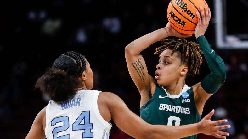 Michigan State guard DeeDee Hagemann (0) looks to pass against North Carolina guard Indya Nivar (24) during the second half of NCAA tournament first round at Colonial Life Arena in Columbia, S.C. on Friday, March 22, 2024.