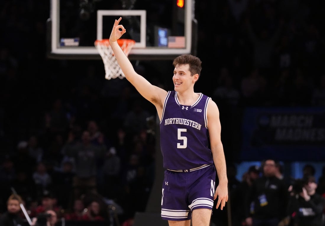 March 22, 2024, Brooklyn, NY, USA;  Northwestern Wildcats guard Ryan Langborg (5) reacts after a three pointer in overtime against the Florida Atlantic Owls in the first round of the 2024 NCAA Tournament at the Barclays Center. Mandatory Credit: Robert Deutsch-USA TODAY Sports