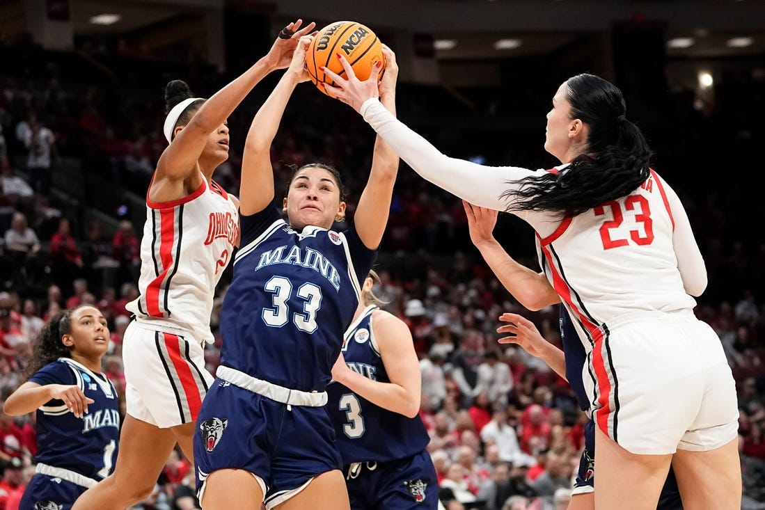 Mar 22, 2024; Columbus, OH, USA; Maine Black Bears forward Adrianna Smith (33) battles for a rebound with Ohio State Buckeyes guard Taylor Thierry (2) and forward Rebeka Mikulasikova (23) during the second half of the women’s basketball NCAA Tournament first round game at Value City Arena. Ohio State won 80-57.