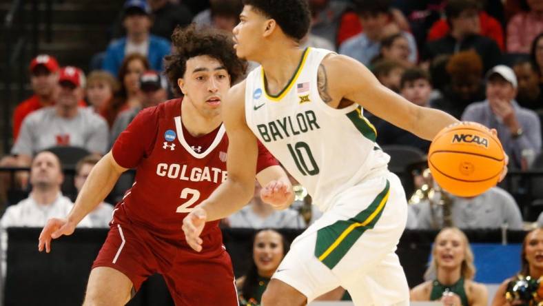 Mar 22, 2024; Memphis, TN, USA;  Baylor Bears guard RayJ Dennis (10) dribbles against Colgate Raiders guard Braeden Smith (2) during the second half of the NCAA Tournament First Round at FedExForum. Mandatory Credit: Petre Thomas-USA TODAY Sports